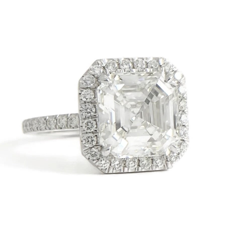 Asscher Halo Diamond Platinum Engagement Ring, 3.63 CTW: Asscher Halo Diamond Platinum Engagement Ring, 3.63 CTW This ring is gorgeous diamond engagement ring! Let us know if you have any questions. Diamonds: 3.63 ctw; 1 asscher cut 3.03 ct, H, VS1; 60 roun