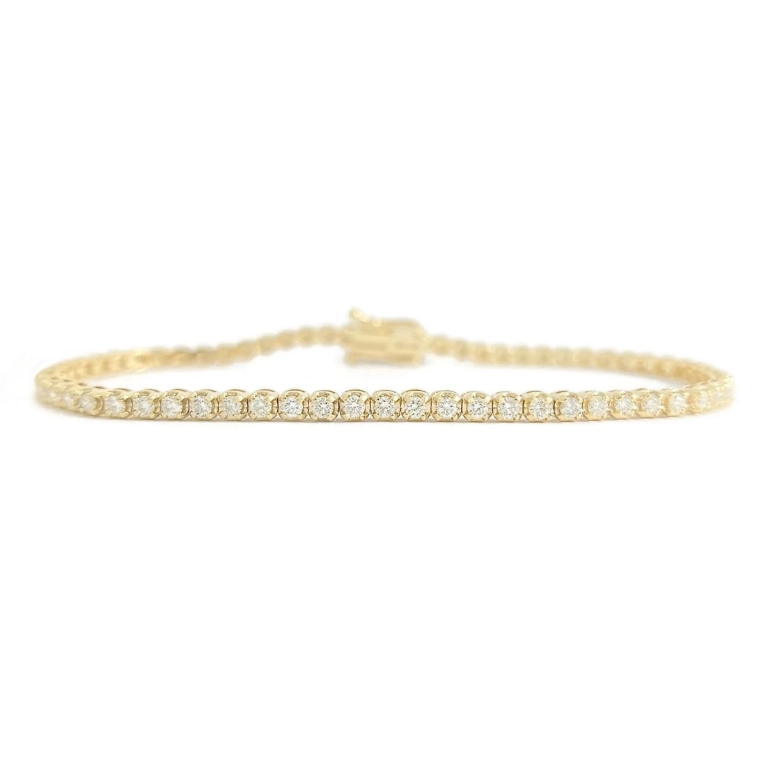 Round Diamond Buttercup Tennis Bracelet 14K Yellow Gold, 7 Inches, 1.75 CTW: Round Diamond Buttercup Tennis Bracelet 14K Yellow Gold, 7 Inches, 1.75 CTW This is a unique yet classic tennis bracelet! Please let us know if you have any questions :) Diamonds: 65 round brilliant