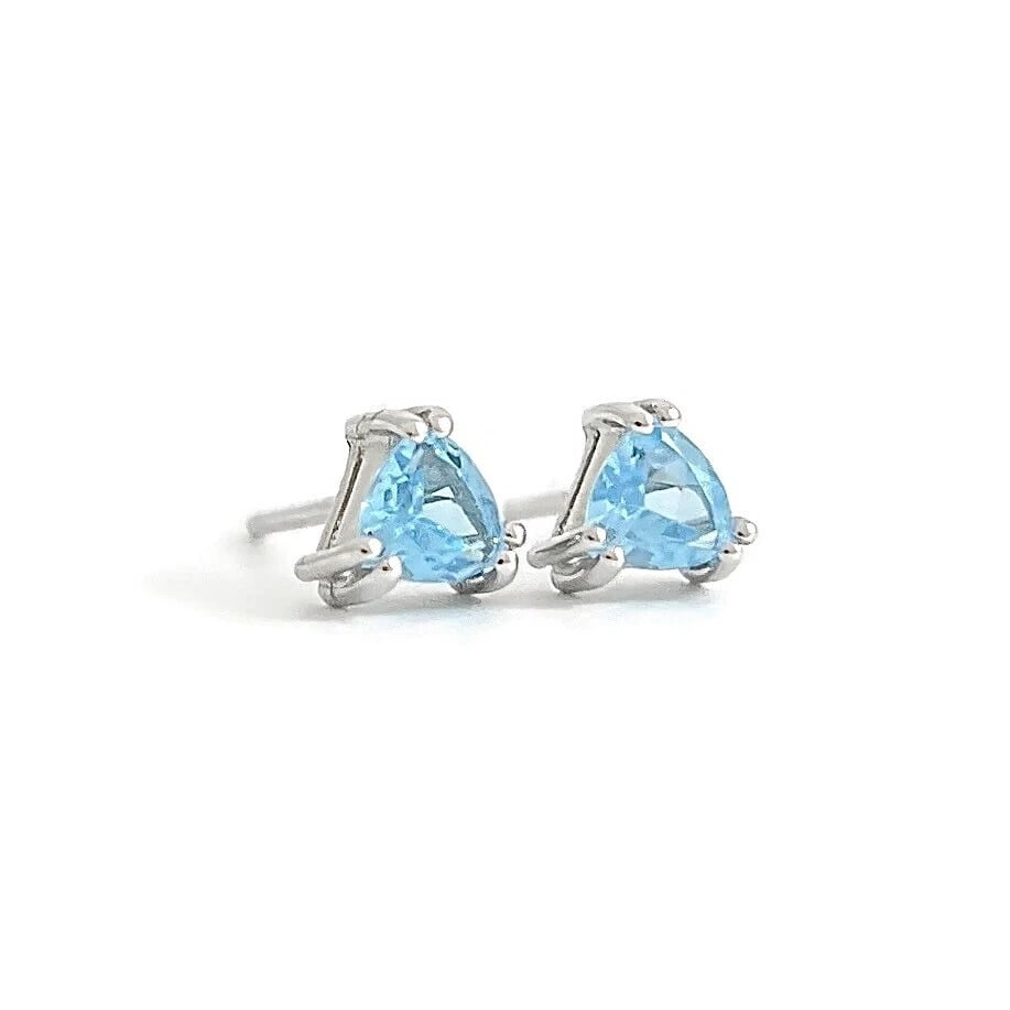 Triangle Trillion Cut Blue Topaz Gemstone Stud Earrings 14K White Gold, .52 CTW: Triangle Trillion Cut Blue Topaz Gemstone Stud Earrings 14K White Gold, .52 CTW These are lovely earrings! Please let us know if you have any questions. Gemstones: 2 triangle trillion cut blue topaz