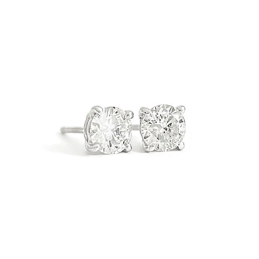 Round Diamond Stud Earrings 14K White Gold 4-Prong Basket, .66 CTW: Round Diamond Stud Earrings 14K White Gold 4-Prong Basket, .66 CTW These are gorgeous diamond stud earrings! Please let us know if you have any questions. Diamonds: 2 round brilliant cuts .66 ctw, F,