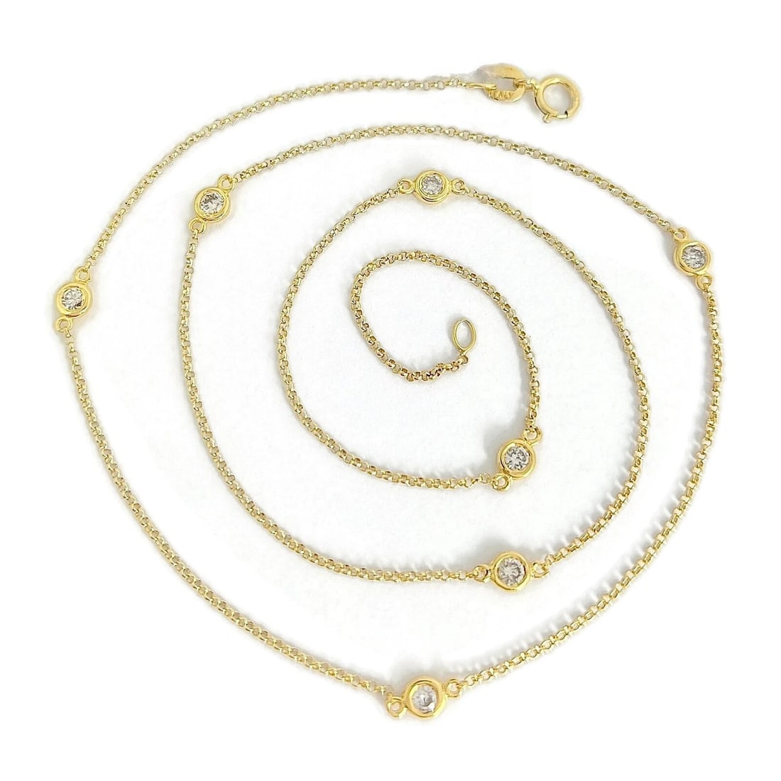 Italian Diamond Bezel Station Necklace 14K Yellow Gold, 18 Inches, .42 CTW: Italian Diamond Bezel Station Necklace 14K Yellow Gold, 18 Inches, .42 CTW This is a classic beautiful necklace. Please let us know if you have any questions :) Diamonds: 7 round brilliant cuts, .42