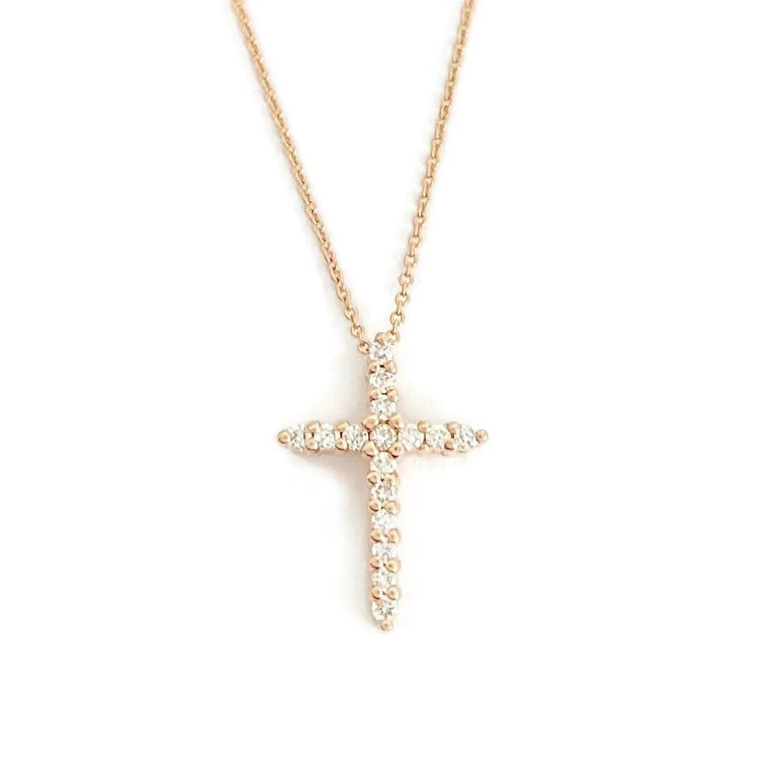 Small Diamond Cross Religious Pendant Necklace 14K Rose Gold .16 CTW: Small Diamond Cross Religious Pendant Necklace 14K Rose Gold .16 CTW This is a beautiful diamond cross necklace. Please let us know if you have any questions. Diamonds: 16 round brilliant cuts .16 ctw