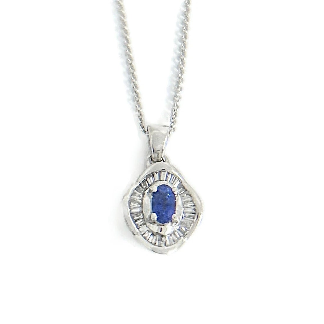 Oval Sapphire Baguette Diamond Halo Pendant Necklace 14K White Gold, .60 CTW: Oval Sapphire Baguette Diamond Halo Pendant Necklace 14K White Gold, .60 CTW This is a beautiful necklace. Please let us know if you have any questions :) Gemstone: 1 oval Ceylon blue sapphire .25 ct 