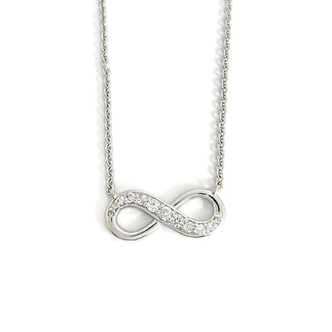Diamond Infinity Pendant Necklace 14K White Gold, .20 CTW: Diamond Infinity Pendant Necklace 14K White Gold, .20 CTW This is a beautiful necklace. Please let us know if you have any questions :) Diamonds: 11 round brilliant cuts, .20 ctw, G-H, I1 Metal: 14K w