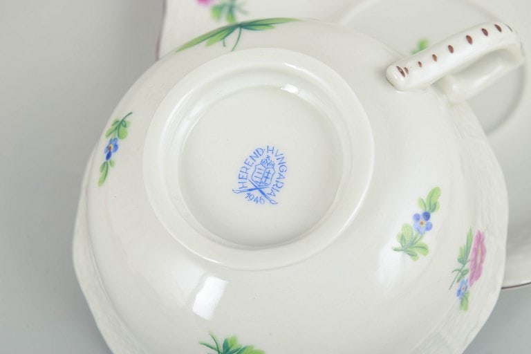 Herend, Hungary. Set of four porcelain teacups with saucers with flowers in pink and blue tones. - 4