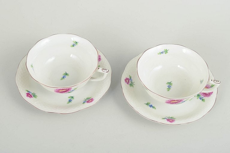 Herend, Hungary. Set of two porcelain teacups with saucers with flowers in pink and blue tones. - 2