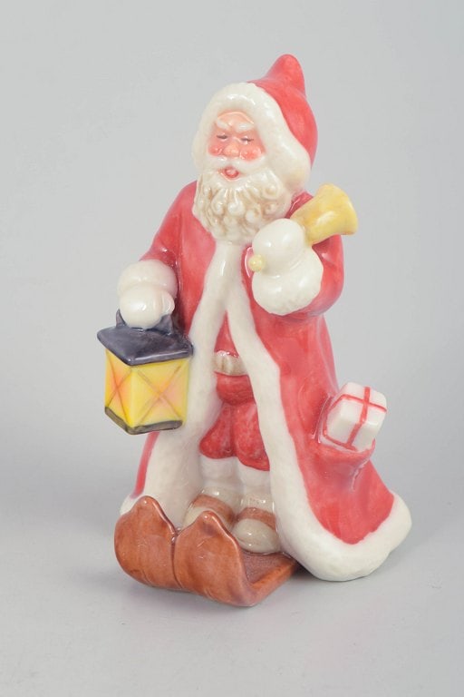 Royal Copenhagen, Denmark. Rare Santa Claus porcelain figurine with lantern and gift sack. Dated (1 of 5)