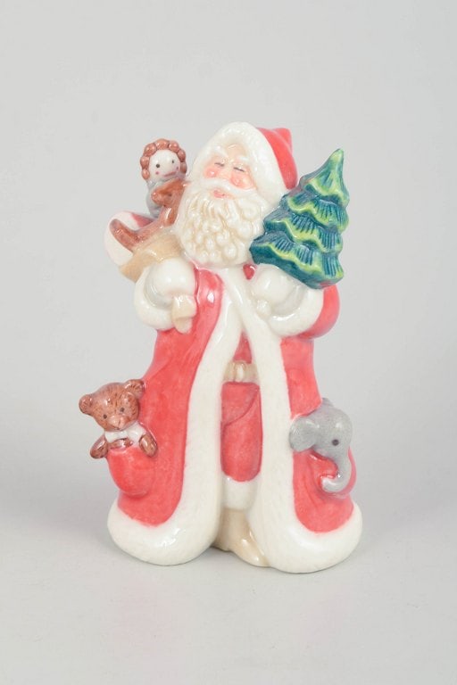 Royal Copenhagen, Denmark. Rare Santa Claus porcelain figurine with gift sack over the shoulder. (1 of 5)