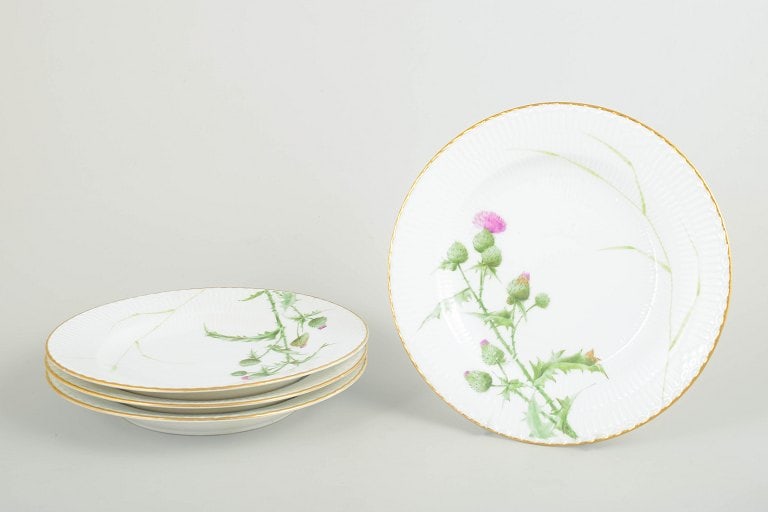 Royal Copenhagen, Denmark. Thistle, set of four porcelain dinner plates in green and pink tones. (1 of 4)