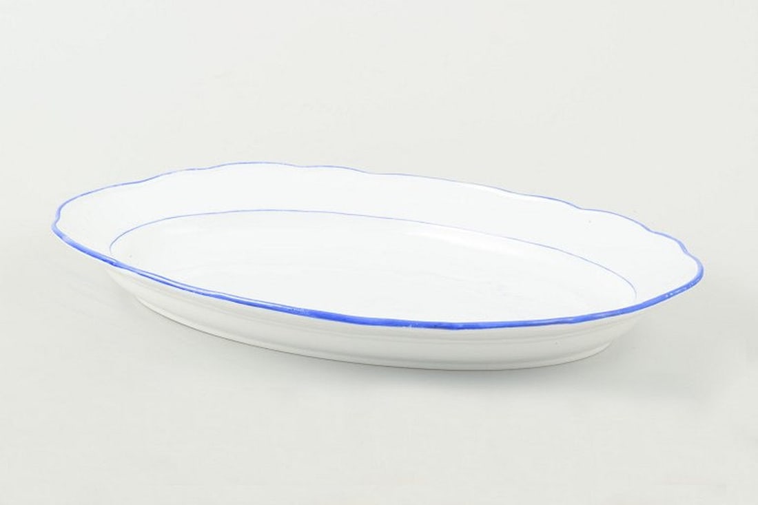 Meissen, Germany. Serving platter in white-glazed porcelain with scalloped rim and blue trim. Circa (1 of 4)