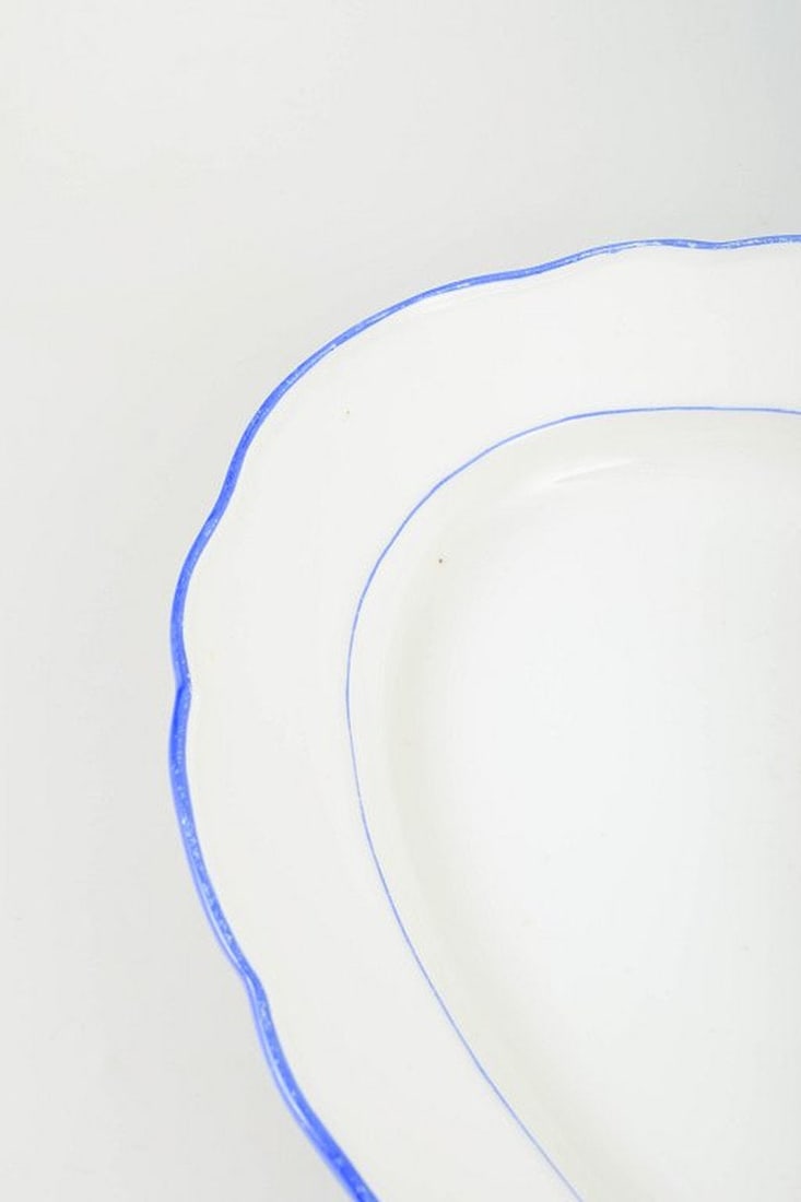 Meissen, Germany. Serving platter in white-glazed porcelain with scalloped rim and blue trim. Circa - 3