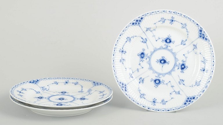 Royal Copenhagen, Denmark. Blue Fluted Half Lace, set of three porcelain salad plates with: Royal Copenhagen Blue Fluted Half Lace, set of three salad plates. Set of three hand-painted porcelain salad plates from the Blue Fluted Half Lace service with classic underglaze decoration in cobalt 