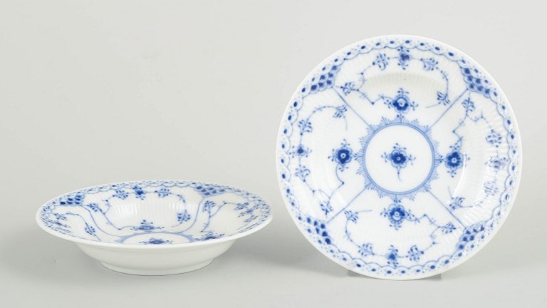 Royal Copenhagen, Denmark. Blue Fluted Half Lace, set of two porcelain small deep plates with: Royal Copenhagen Blue Fluted Half Lace, set of two small deep plates. Set of two small breakfast deep plates in hand-painted porcelain from the Blue Fluted Half Lace service with classic underglaze de