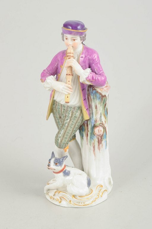 Meissen, Germany. Porcelain figurine, nobleman with flute and dog with polychrome colors. 19th: Meissen figurine, nobleman with flute and dog. Porcelain figurine depicting a standing nobleman with a flute beside a tree stump and a small dog at his feet. Executed in hand-painted porcelain with po