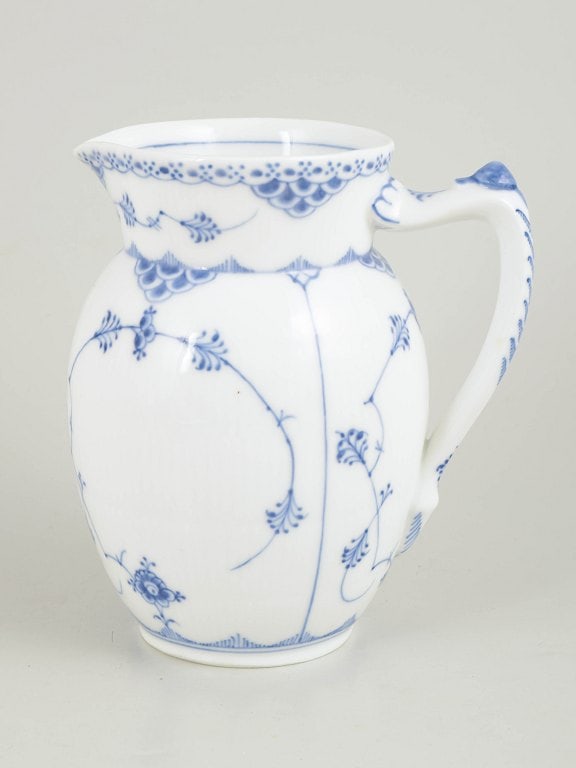 Royal Copenhagen, Denmark. Blue Fluted Half Lace porcelain pitcher with decoration in cobalt blue.: Royal Copenhagen Blue Fluted Half Lace pitcher. Pitcher in hand-painted porcelain from Blue Fluted Half Lace with classic underglaze decoration in cobalt blue, fluted panels and characteristic lace bo