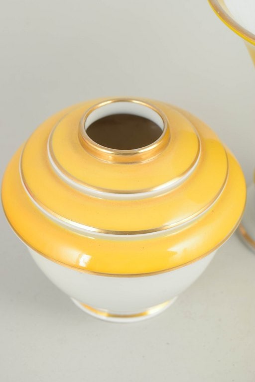 Germany. Two art deco small porcelain vases in yellow and white tones with gilded details. Approx. - 3