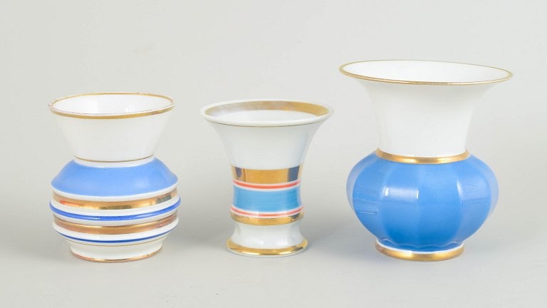 Germany. Set of three art deco small porcelain vases in blue and white tones with gilded details. (1 of 4)