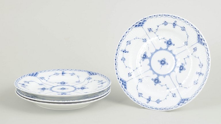 Royal Copenhagen, Denmark. Blue Fluted Half Lace set of four salad plates with underglaze cobalt: Royal Copenhagen Blue Fluted Half Lace set of four salad plates. Set of four hand-painted porcelain salad plates from the Blue Fluted Half Lace service with classic underglaze cobalt blue decoration a