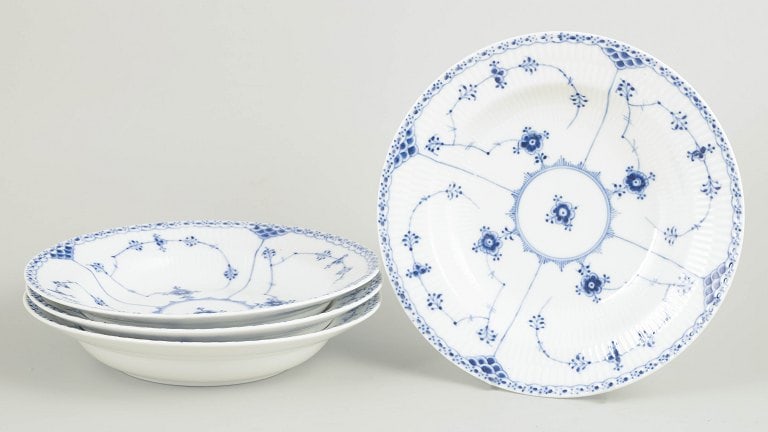 Royal Copenhagen, Denmark. Blue Fluted Half Lace set of four soup plates with underglaze cobalt blue: Royal Copenhagen Blue Fluted Half Lace set of four soup plates. Set of four hand-painted porcelain soup plates from the Blue Fluted Half Lace service with classic underglaze cobalt blue decoration and
