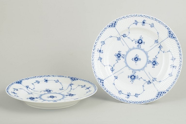 Royal Copenhagen, Denmark. Blue Fluted Half Lace two dinner plates with underglaze cobalt blue: Royal Copenhagen Blue Fluted Half Lace two dinner plates. Two hand-painted porcelain dinner plates from the Blue Fluted Half Lace service with classic underglaze cobalt blue decoration and characteris