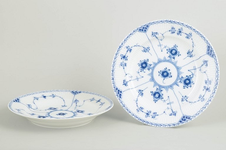 Royal Copenhagen, Denmark. Blue Fluted Half Lace two dinner plates with underglaze cobalt blue: Royal Copenhagen Blue Fluted Half Lace two dinner plates. Two hand-painted porcelain dinner plates from the Blue Fluted Half Lace service with classic underglaze cobalt blue decoration and characteris