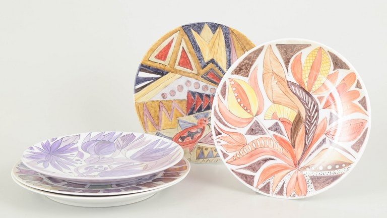 Europe. Set of five hand painted porcelain plates with geometric motifs in warm and violet tones. (1 of 4)