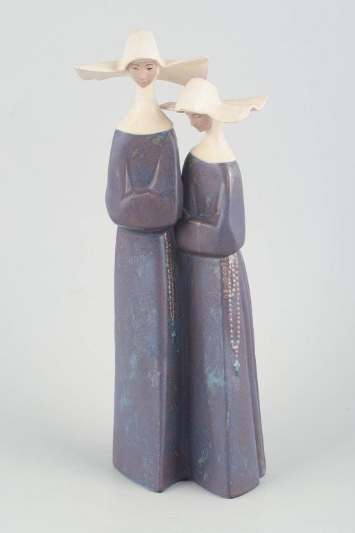 Lladró,, Spain. Large porcelain sculpture of two female figures with wide hats in violet and (1 of 4)