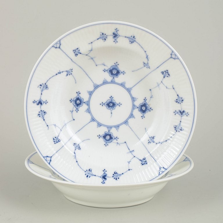 Royal Copenhagen, Denmark. Blue Fluted Plain set of two porcelain soup plates with underglaze cobalt: Royal Copenhagen Blue Fluted Plain two deep plates. Two hand-painted deep plates in the Blue Fluted Plain pattern, model 1/167, from the 1920s. First factory quality. Origin: Denmark. Material: Porcel