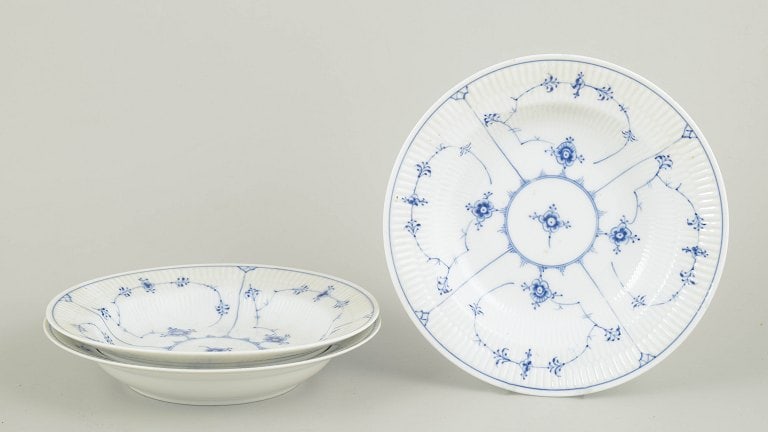 Royal Copenhagen, Denmark. Blue Fluted Plain set of three porcelain soup plates with underglaze: Royal Copenhagen Blue Fluted Plain soup plates, set of three. Three hand-painted soup plates in the Blue Fluted Plain pattern, model 1/165, from the 1920s. First factory quality. Origin: Denmark. Mate