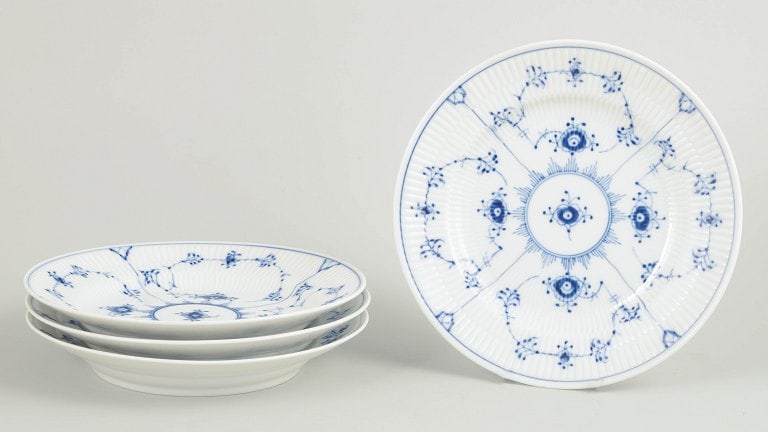 Royal Copenhagen, Denmark. Blue Fluted Plain set of four porcelain lunch/salad plates with: Royal Copenhagen Blue Fluted Plain set of four lunch/salad plates. Set of four lunch/salad plates in hand-painted porcelain from the Blue Fluted Plain service with classic underglaze cobalt blue decor