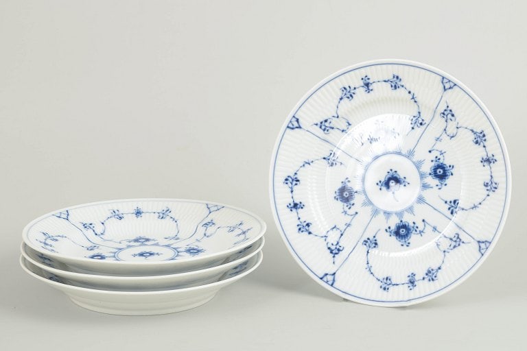 Royal Copenhagen, Denmark. Blue Fluted Plain set of four porcelain lunch plates with underglaze: Royal Copenhagen Blue Fluted Plain set of four lunch plates. Set of four lunch plates in hand-painted porcelain from the Blue Fluted Plain service with classic underglaze cobalt blue decoration and fl