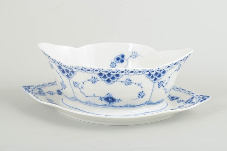 Royal Copenhagen, Denmark. Blue Fluted Half Lace, porcelain sauce boat with stand with decoration in: Royal Copenhagen Blue Fluted Half Lace, sauce boat with stand. Sauce boat with stand in hand-painted porcelain from the Blue Fluted Half Lace service with classic underglaze decoration in cobalt blue,