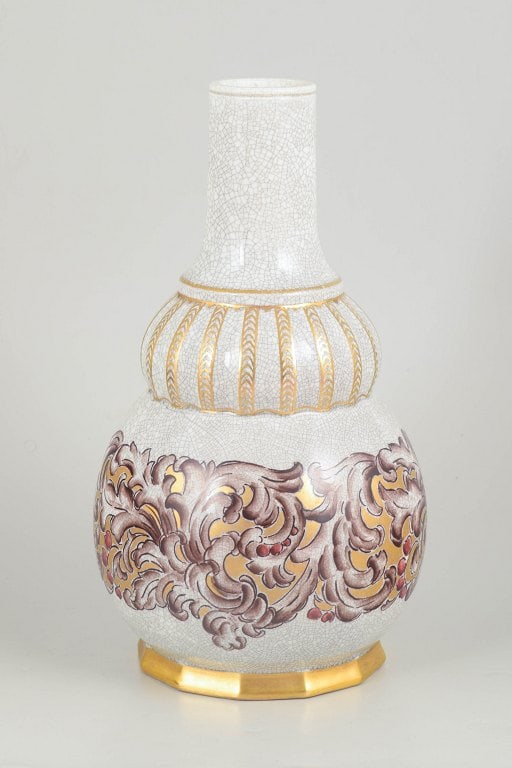 Dahl-Jensen, Denmark. Art deco porcelain vase with relief-style ornamentation. Approx. 1920-1930s.: Dahl-Jensen art deco porcelain vase. Elegant porcelain vase with tall slender neck and baluster-shaped body decorated with relief-style ornamentation in gilt and polychrome tones against a crackle gla