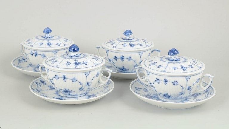 Royal Copenhagen, Denmark. Blue Fluted Plain set of four porcelain bouillon cups with saucers in (1 of 5)