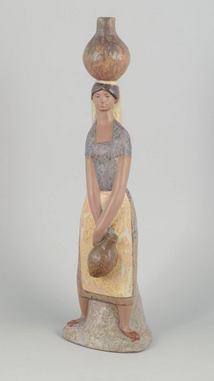 Lladró,, Spain. Porcelain figurine of woman with vessels in muted glaze tones. Approx. (1 of 4)