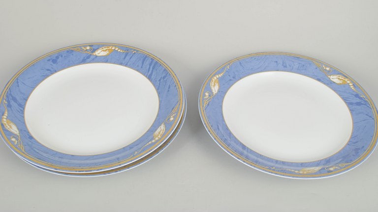 Royal Copenhagen, Denmark. Blue Magnolia, set of three porcelain dinner plates. Approx. 1990s. - 2