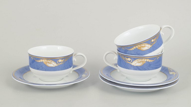 Royal Copenhagen, Denmark. Blue Magnolia, set of three porcelain teacups with matching saucers.: Royal Copenhagen Blue Magnolia, set of three teacups with matching saucers. Elegant porcelain teacups in the Blue Magnolia pattern, models 084 and 085, produced in the 1990s. First factory quality and