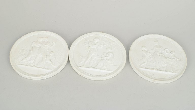 Royal Copenhagen, Denmark. Set of three biscuit wall plaques after Thorvaldsen. Mid-20th century. (1 of 4)