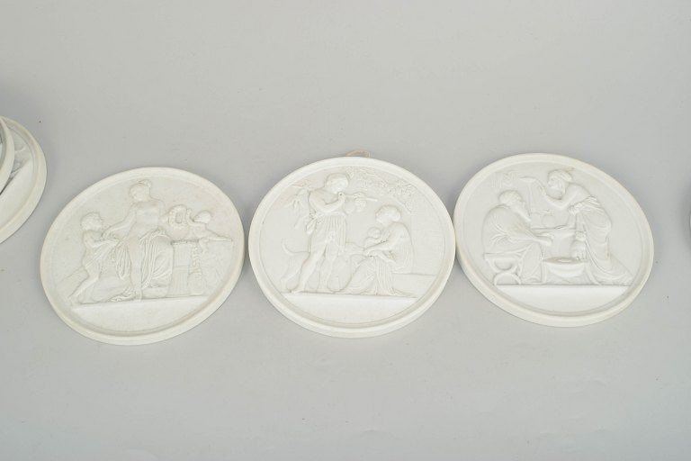 Bing & Grøndahll, Denmark. Set of seven biscuit wall plaques after Thorvaldsen. 20th century. - 2