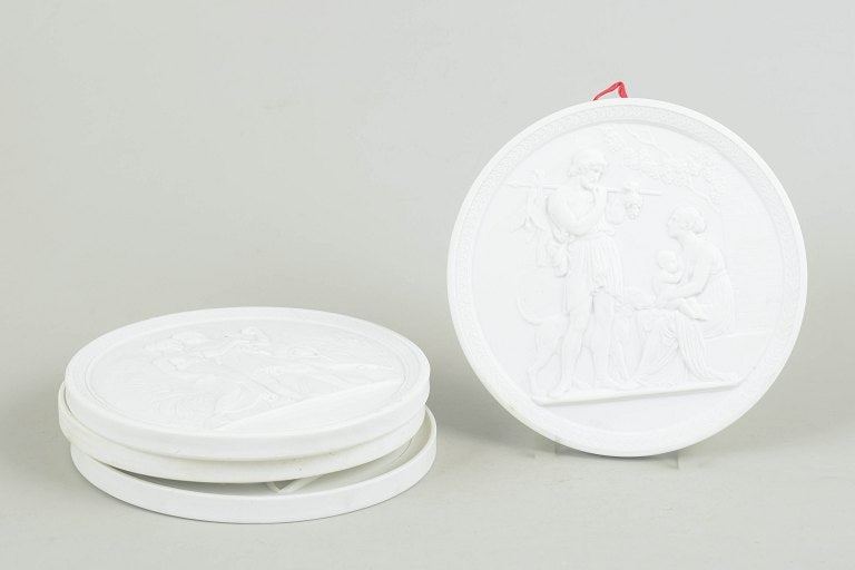 Royal Copenhagen, Denmark. Set of four biscuit wall plaques after Thorvaldsen. 20th century. - 2
