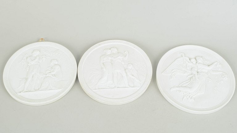 Royal Copenhagen, Denmark. Set of three biscuit wall plaques after Thorvaldsen. 20th century. (1 of 4)