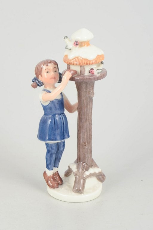 Royal Copenhagen, Denmark. Porcelain figurine, girl in blue attire by birdhouse. 21st century. (1 of 4)