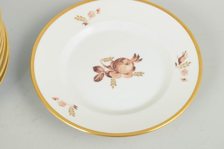 Royal Copenhagen, Denmark. Brown rose, set of eleven porcelain plates with gilded rim. Approx. - 3
