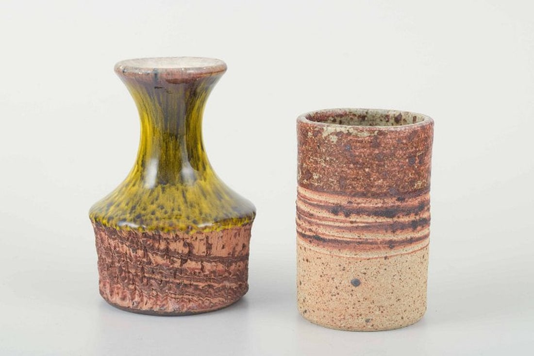 European studio potters. Two small stoneware vases. 1960s-1970s.: European Studio Potters Two small stoneware vases, one cylindrical with incised signature â€œErnst Faxeâ€ underneath, the other with flared neck and yellow-brown runni