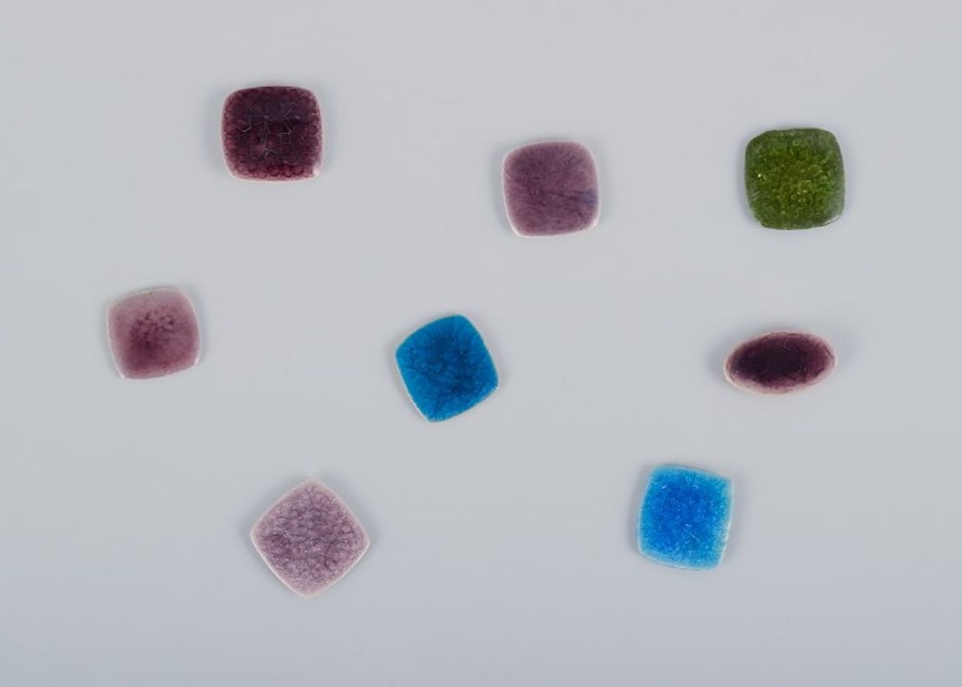 Ole Bjørn Krüger, Danish sculptor and ceramicist. Eight unique ceramic brooches in glazed: Ole Bjørn Krüger (1922-2007), Danish sculptor and ceramicist. Eight unique ceramic brooches in glazed stoneware with shades of purple, blue, and green. 1960s/70s. In excellent condition. Par