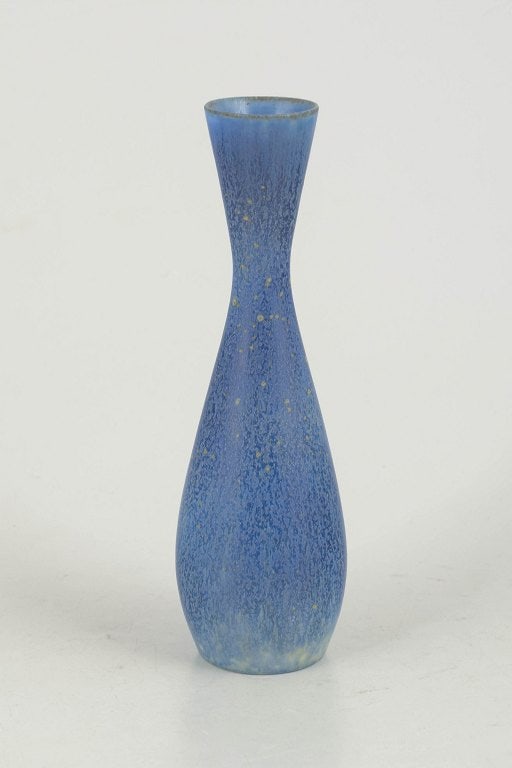 Carl-Harry Stålhane for Rörstrand, Sweden. Slender baluster-shaped stoneware miniature: Carl-Harry Stålhane for Rörstrand, miniature vase. Slender baluster-shaped stoneware vase with a beautiful blue glaze featuring subtle variations and a gently constricted neck. A classic