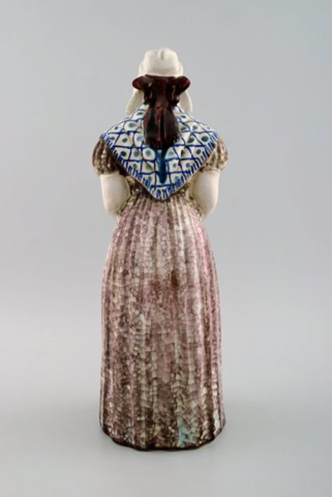 Michael Andersen Ceramics from Bornholm. Large figure of woman with Songbook in national dress. No. - 3