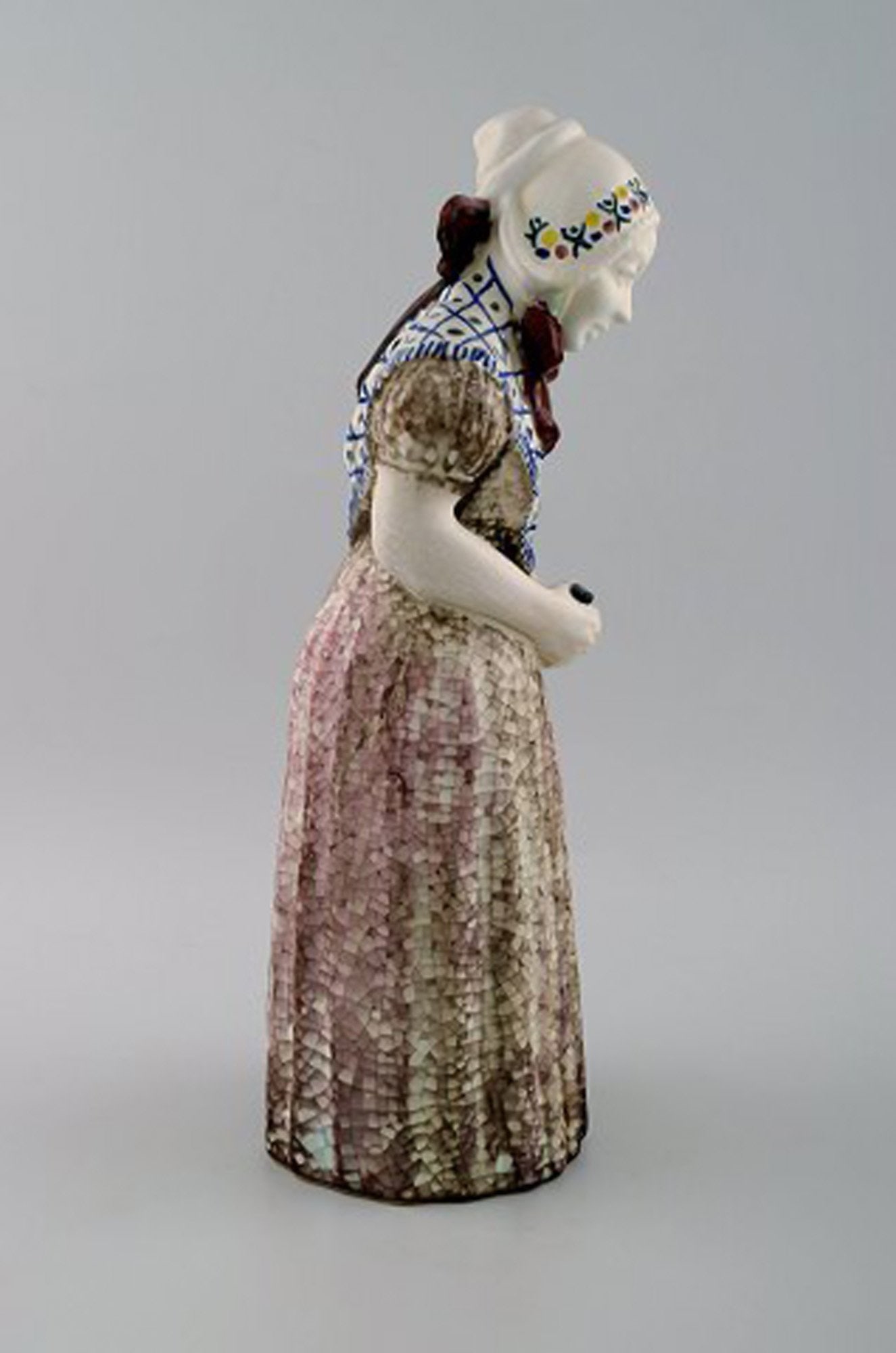 Michael Andersen Ceramics from Bornholm. Large figure of woman with Songbook in national dress. No. - 4