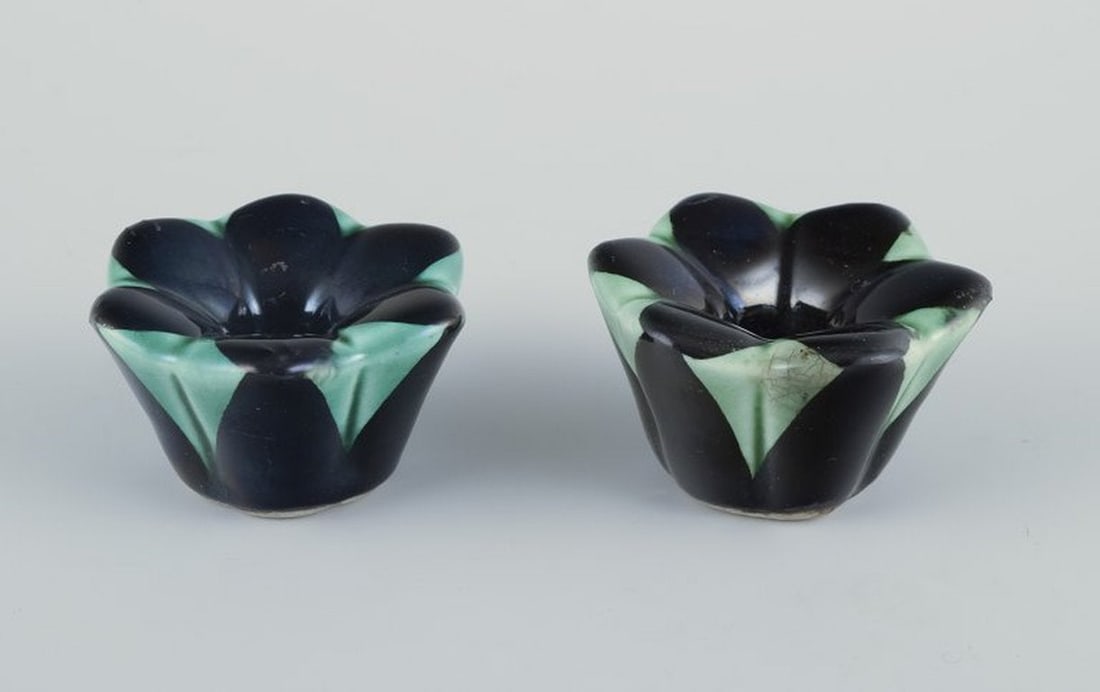 Ilse Claesson for Rörstrand, Sweden. A pair of small candlesticks in glazed faience. 1930s.: Ilse Claesson for Rörstrand, Sweden. A pair of small candlesticks in glazed faience. Art Deco. Hand painted. Glaze in shades of green and black. Dating: 1930s. In perfect condition with natural
