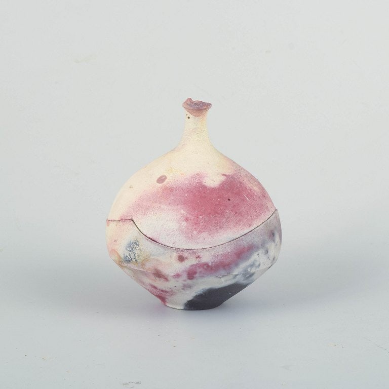 Scandinavian studio potter. Organically shaped lidded jar in thrown stoneware with raw surface. (1 of 4)